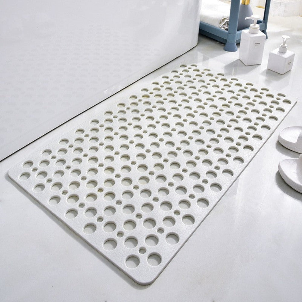 Light beige non-slip shower mat with round drainage holes and textured grip