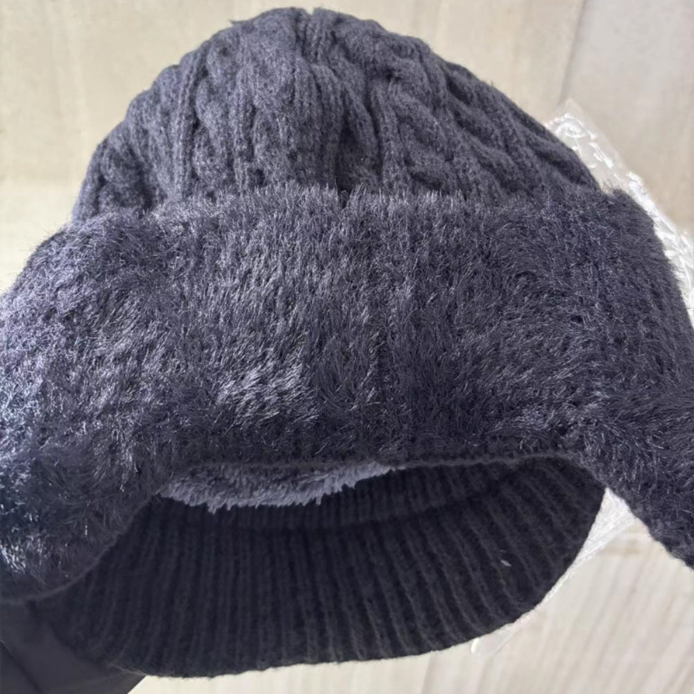 Gray knit trapper ear flap hat with ribbed brim and Derlog logo patch