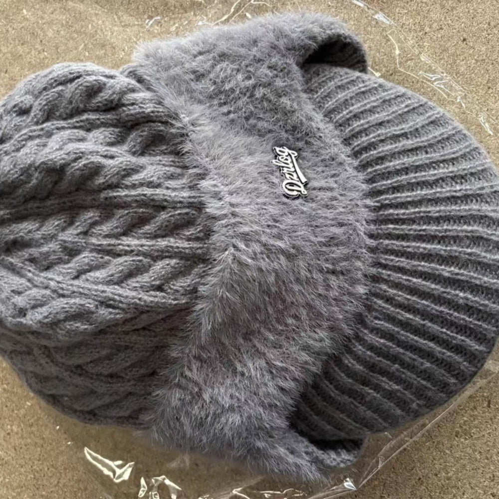 Light gray fuzzy trapper ear flap hat with Derlog logo patch and ribbed side panels