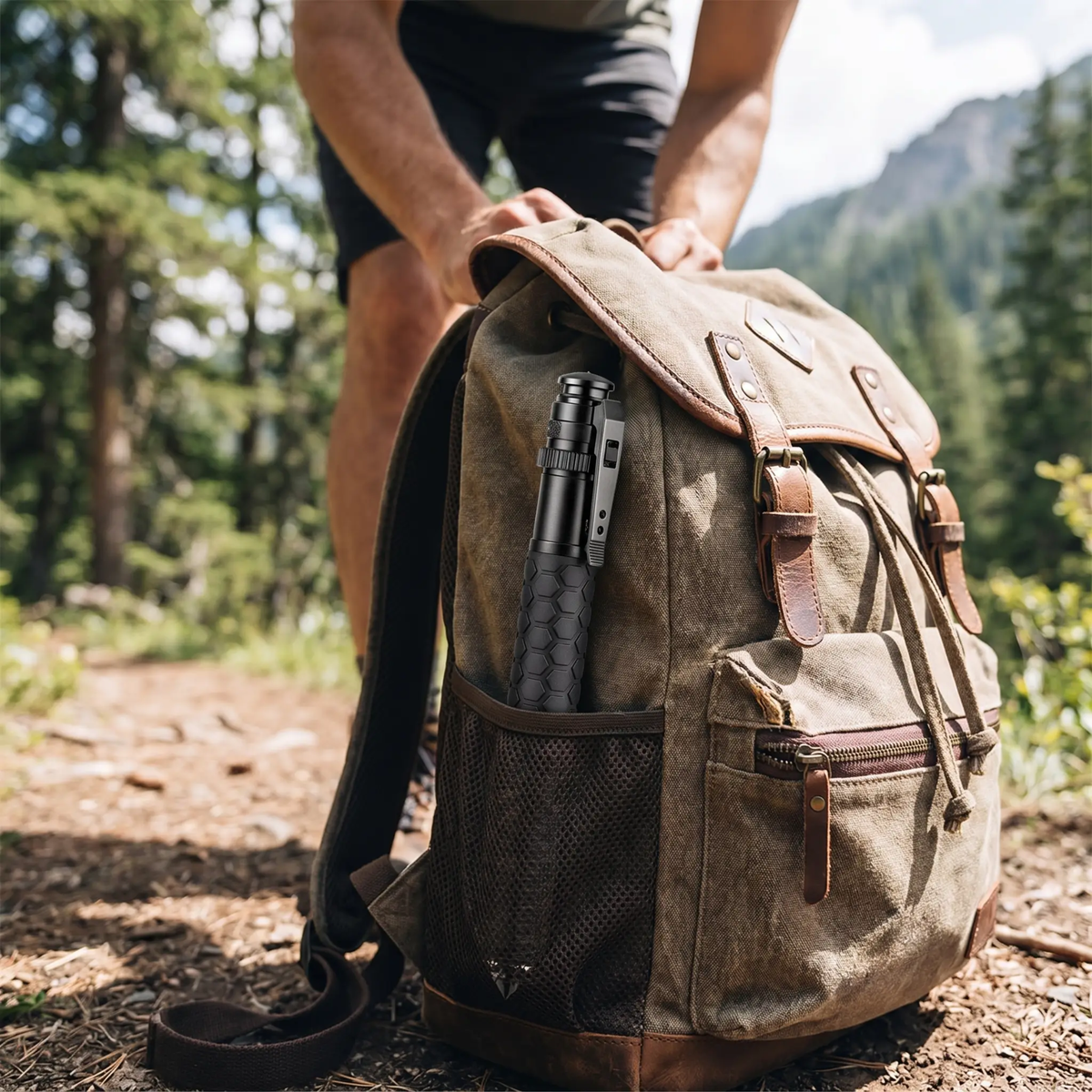 Person holding a brown leather backpack with hiking equipment in a forest setting