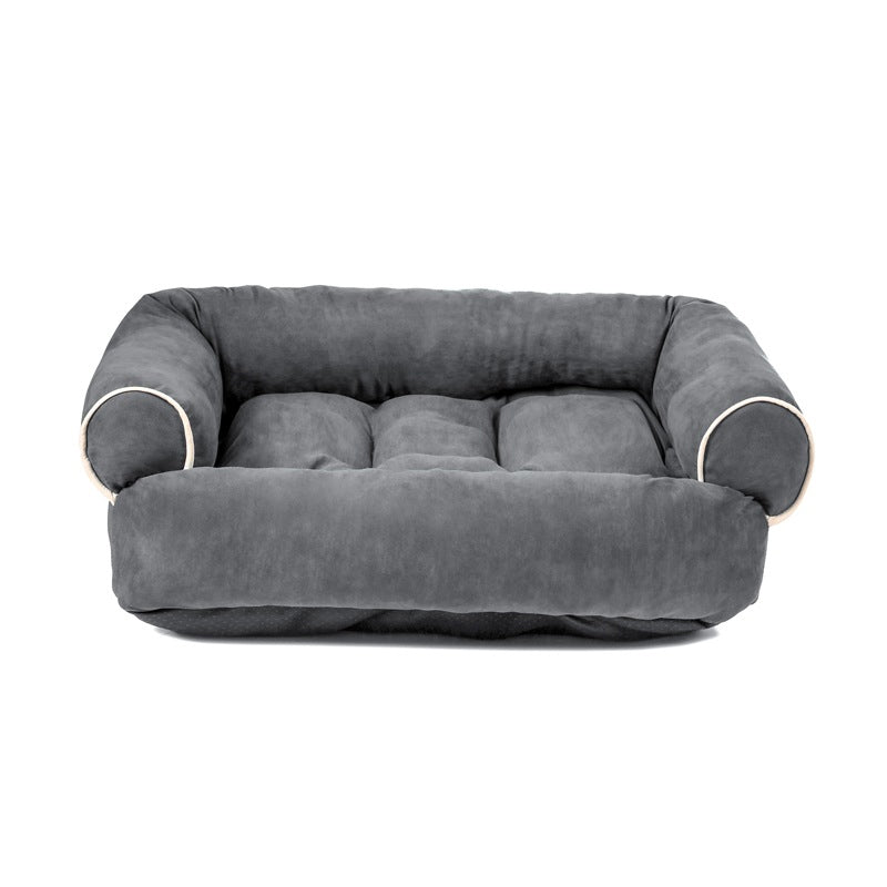Dark gray egg-crate memory foam dog bed with rounded bolsters and supportive inner padding