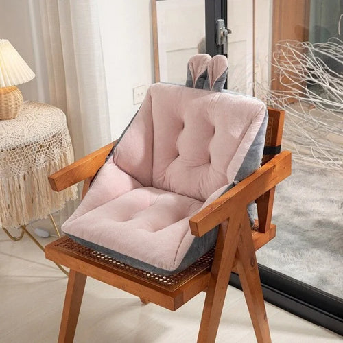 Sciatica relief cushion with light pink padded backrest and contoured seat