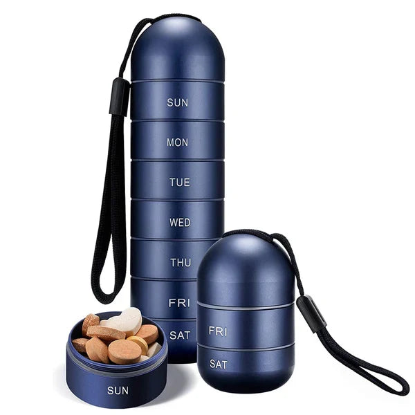 Blue aluminum weekly pill organizer with carrying strap and round base, labeled days