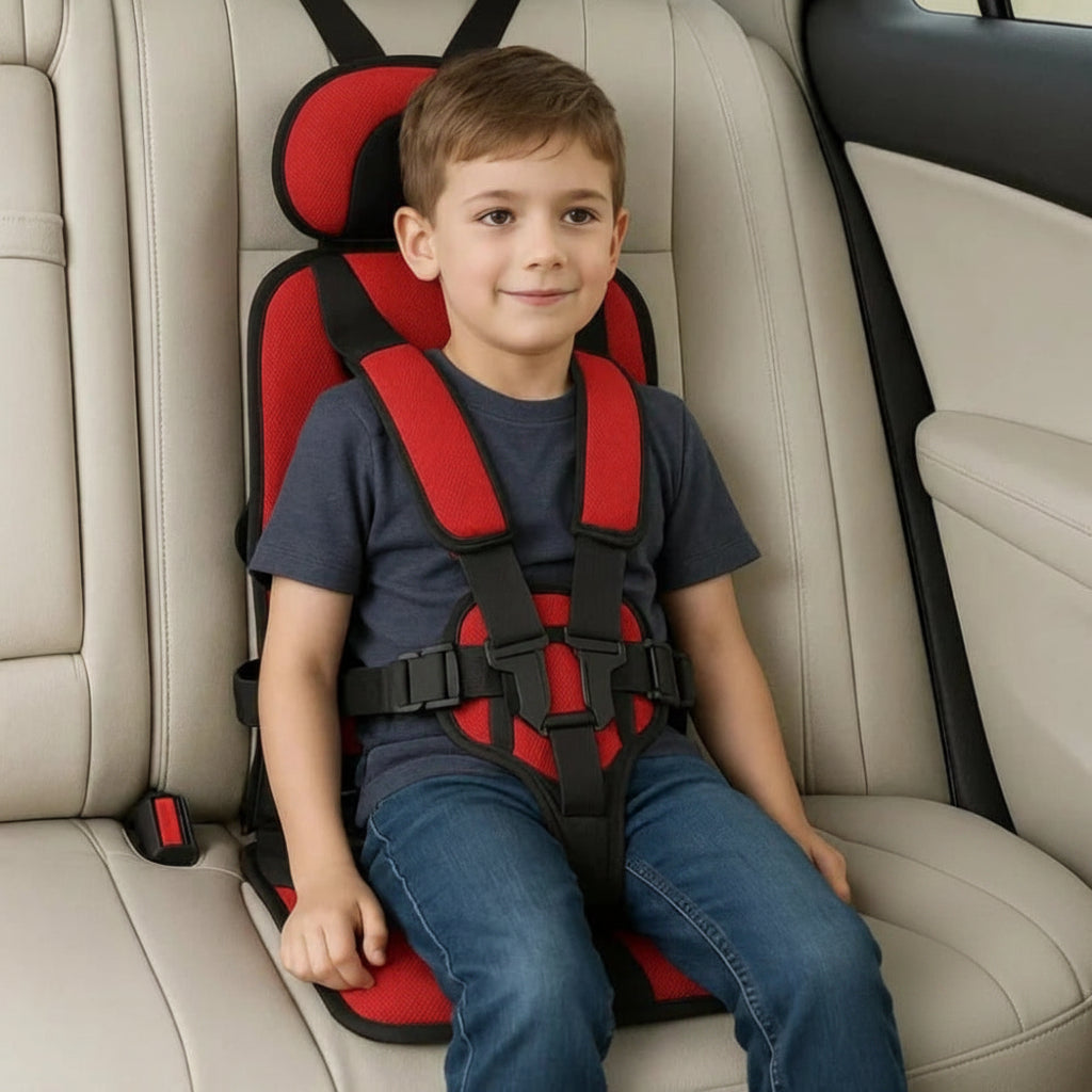 Red kids travel safety seat with padded headrest and black 5-point harness straps