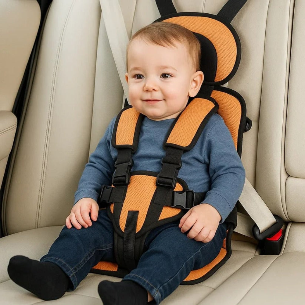 Orange kids travel safety seat with padded headrest and black harness straps