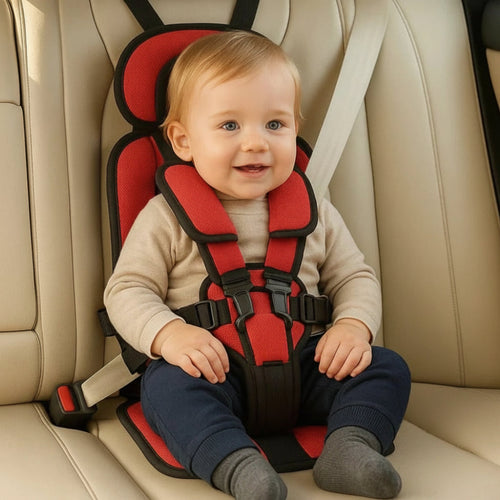 Red kids travel safety seat with padded headrest, shoulder pads, and harness straps