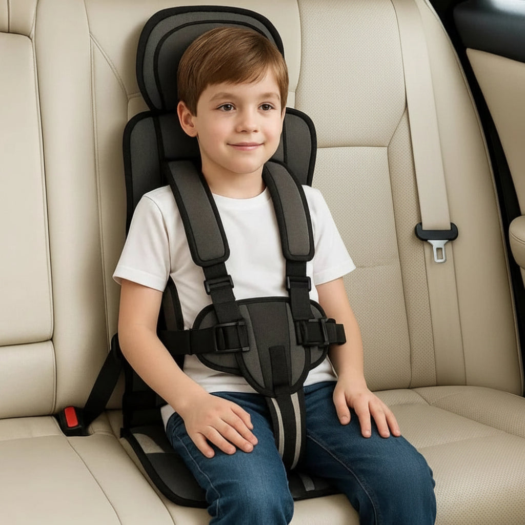 Charcoal kids travel safety seat with padded headrest and adjustable harness straps
