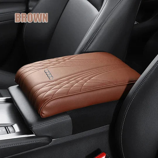 Brown car armrest cushion cover with quilted pattern and embossed car-logo badge