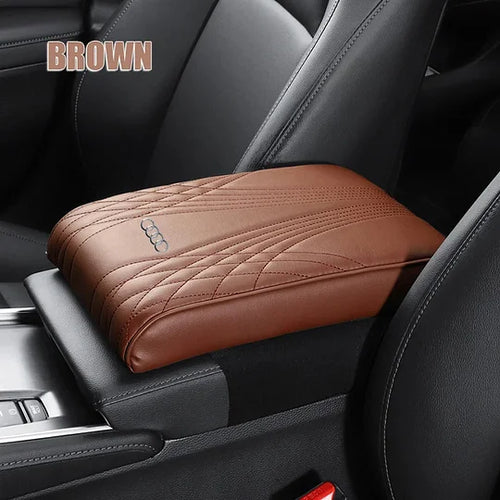 Brown car armrest cushion cover with quilted pattern and embossed car-logo badge