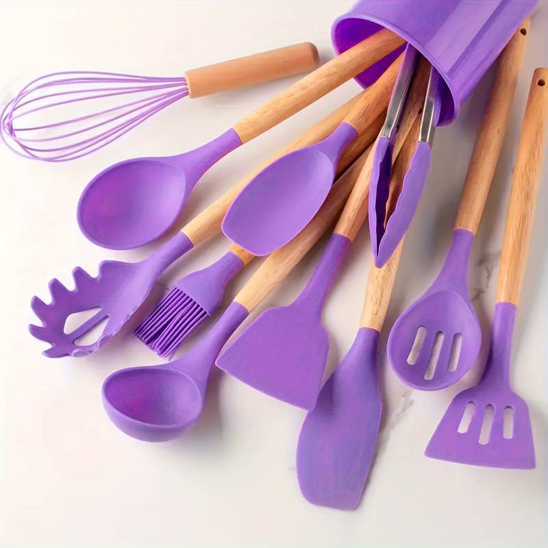 Purple silicone kitchen utensil set with light wood handles: spatulas, ladle, whisk