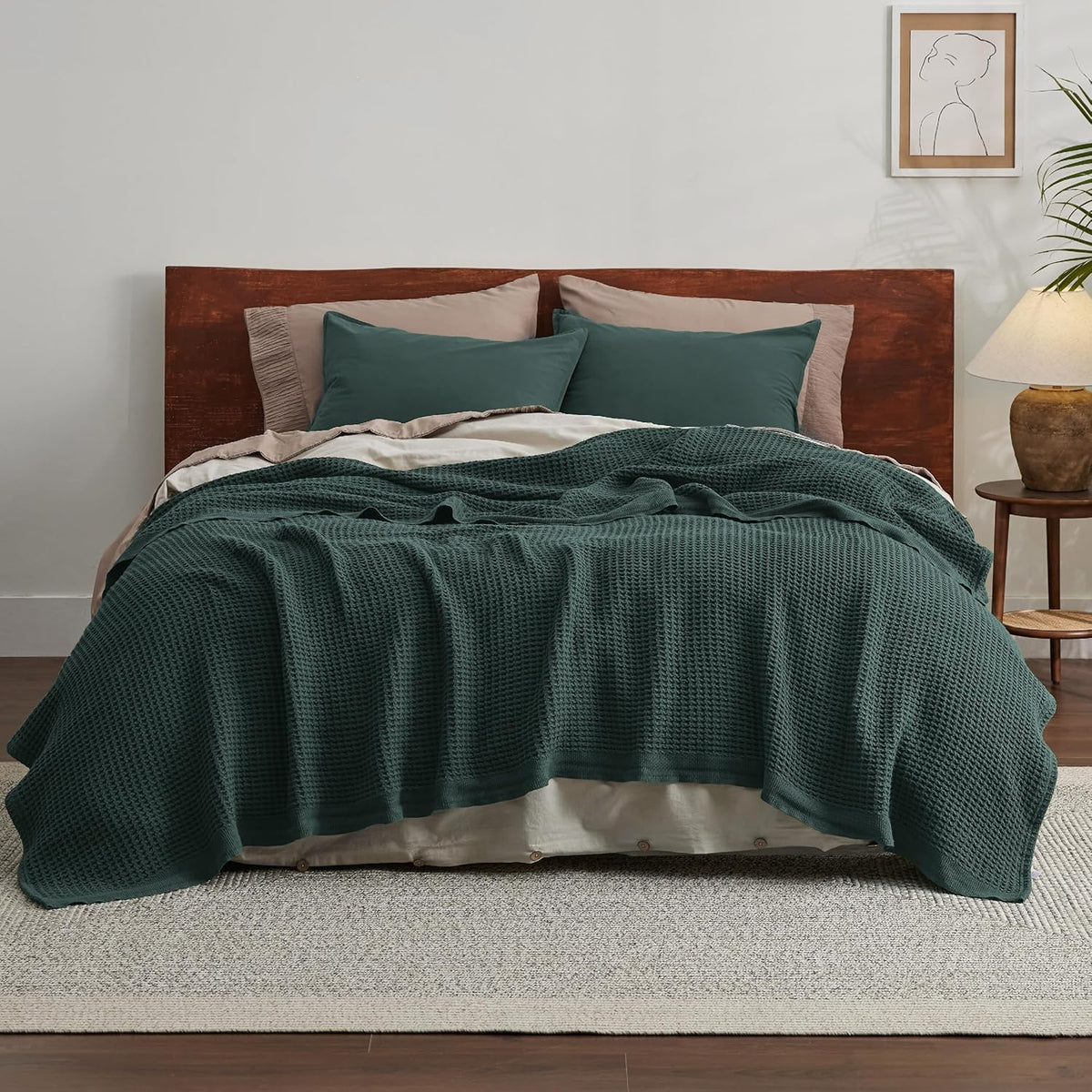 Teal cotton waffle-weave cooling blanket spread across a bed
