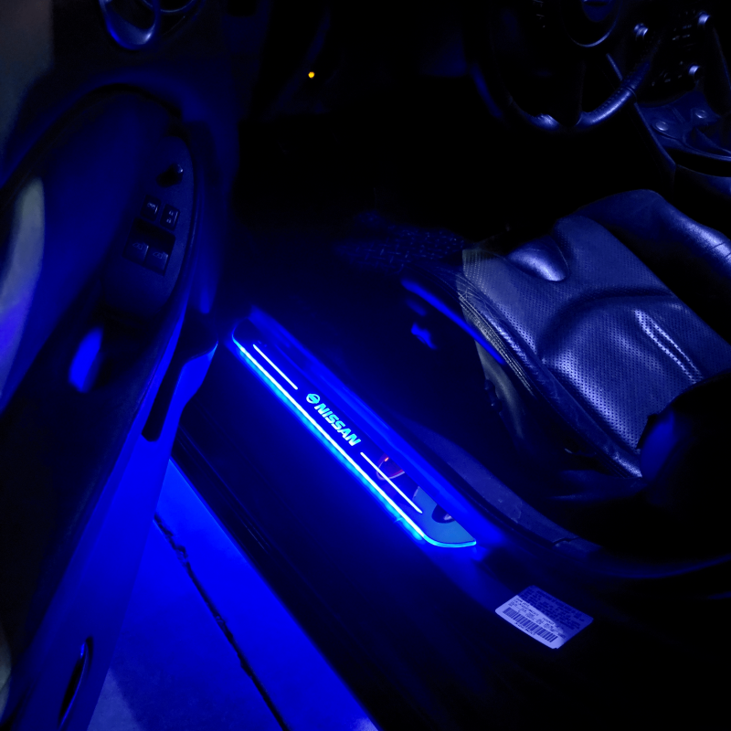 Car interior with blue LED light strip on dashboard