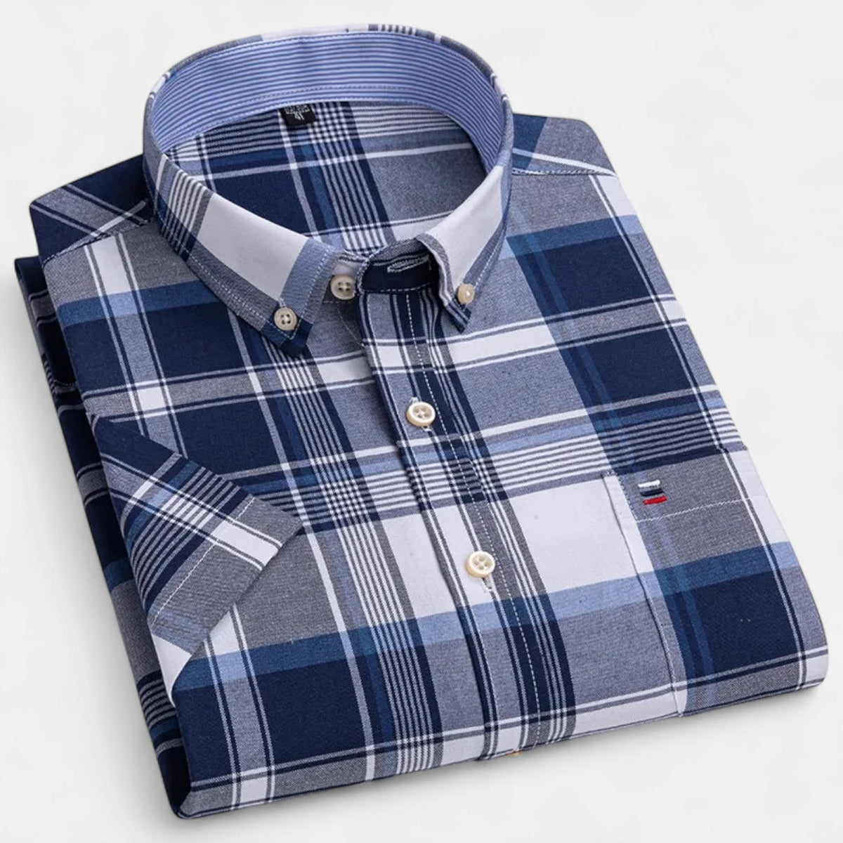 Men's classic short-sleeve button-up shirt in navy plaid with blue-striped collar.
