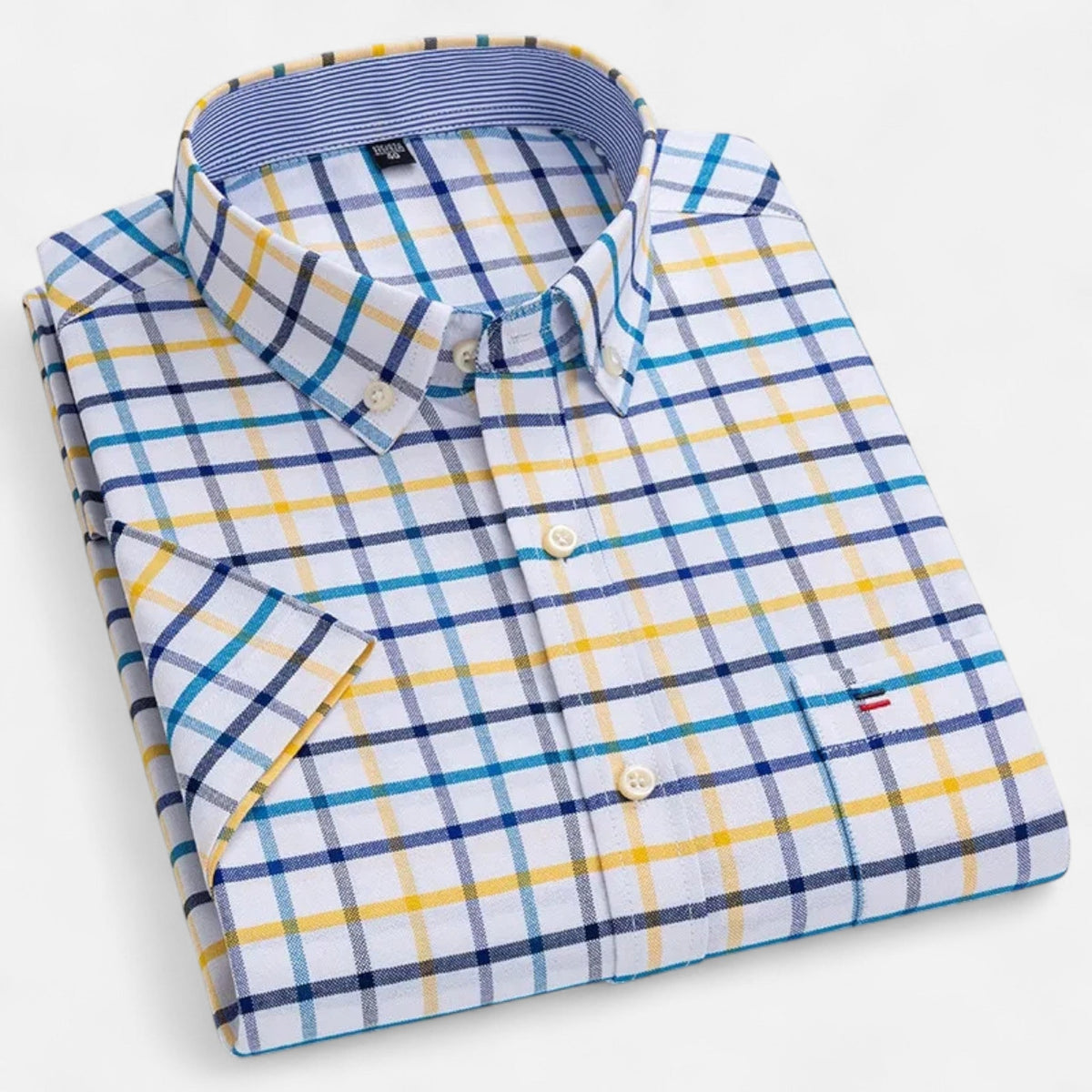 Men's short-sleeve oxford shirt in white with blue and yellow check plaid, folded front view