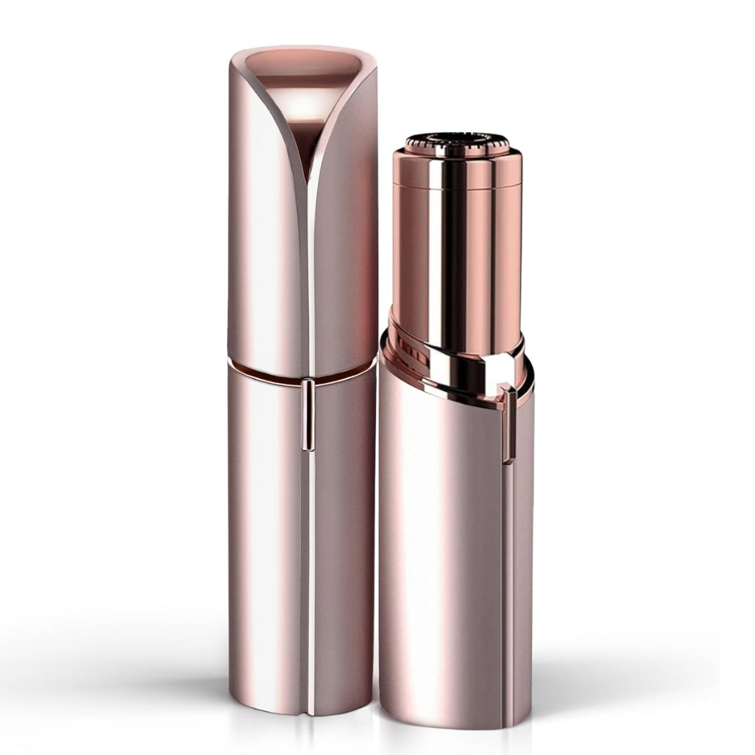 Rose gold and silver facial hair trimmer with hinged cap and blade head