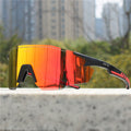 Black polarized sports sunglasses with orange mirrored wrap lenses