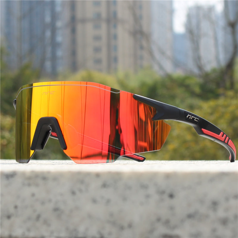 Black polarized sports sunglasses with orange mirrored wrap lenses