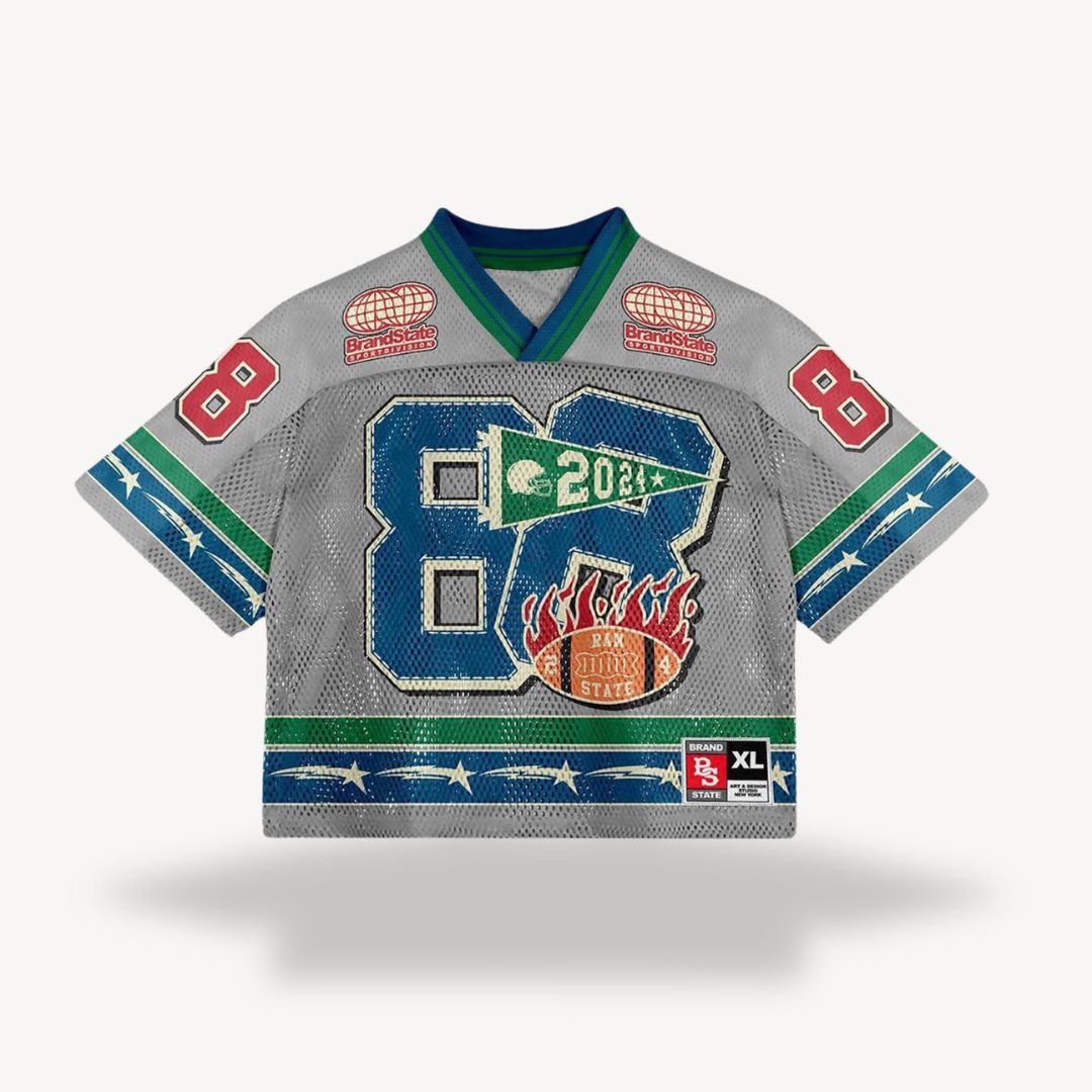 Grey V-neck short sleeve jersey shirt with green accents and large blue front block graphic