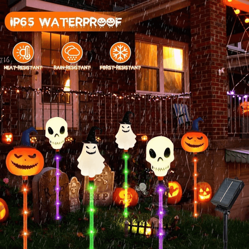 Halloween ground lights with glowing pumpkin, skull, and ghost heads on ground stakes