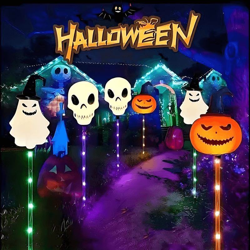 Halloween ground lights with glowing skull, pumpkin, and ghost figures on ground stakes