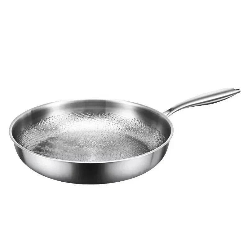 Hammered titanium frying pan with textured cooking surface and short interior walls