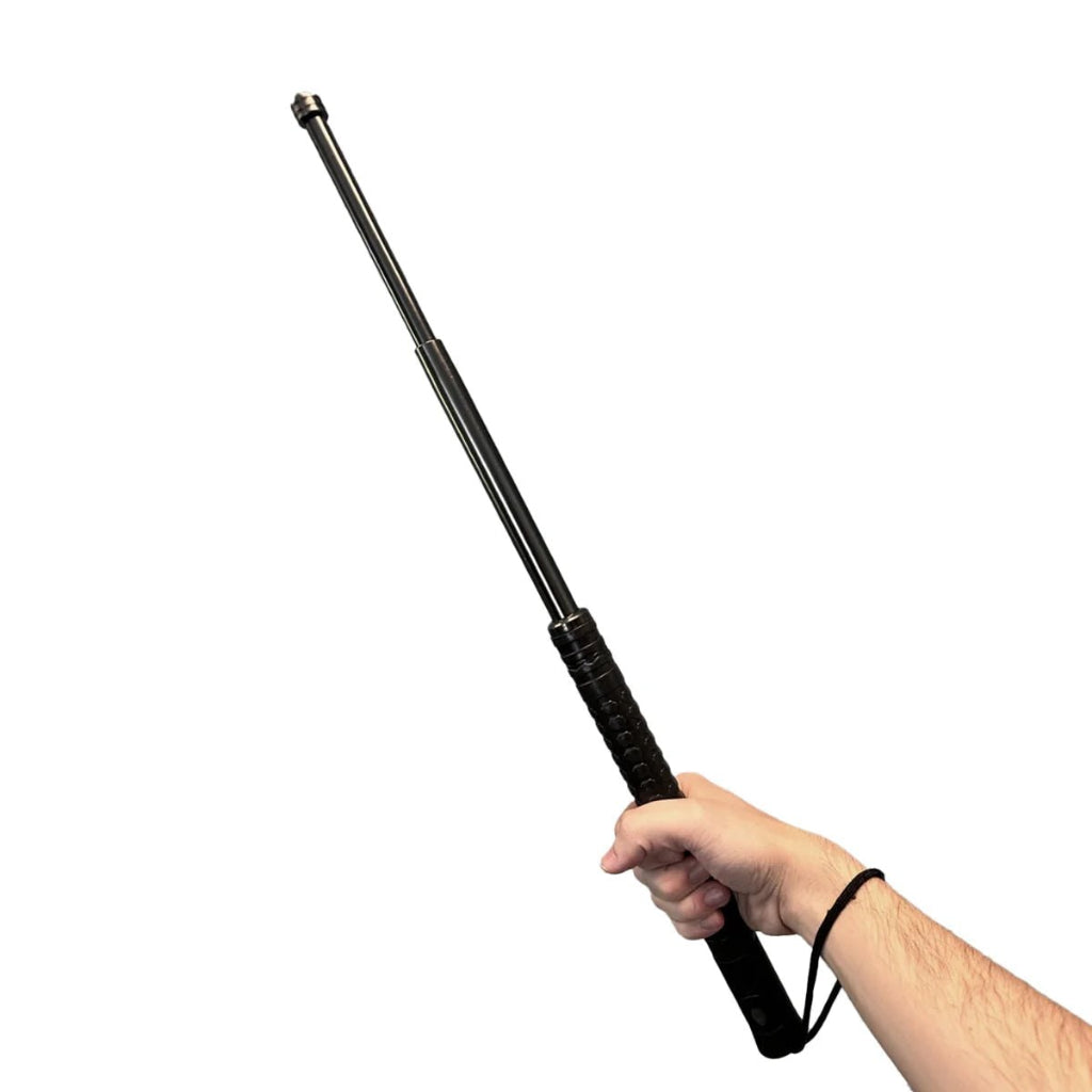 Black telescopic baton held by a hand on a white background