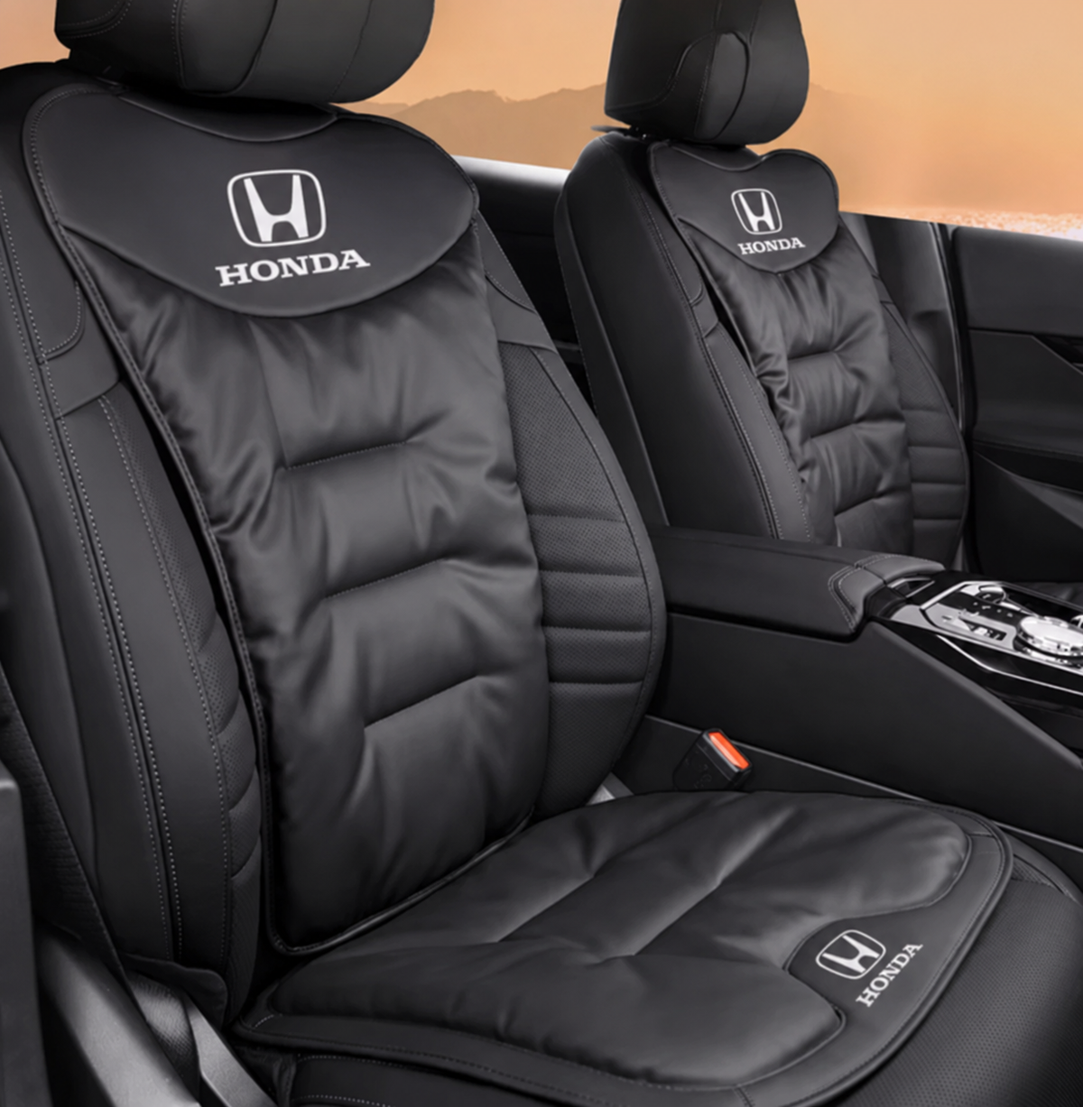 Ergonomic car seat cushion with lumbar support, black cushion with Honda logo on back and seat.