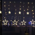 Warm white LED star curtain lights with hanging star ornaments and light strings