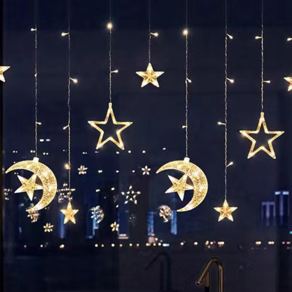 Warm white LED star and moon curtain lights with hanging crescent moons and star ornaments