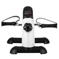 White pedal exercise trainer with black base, handles, and digital LCD display