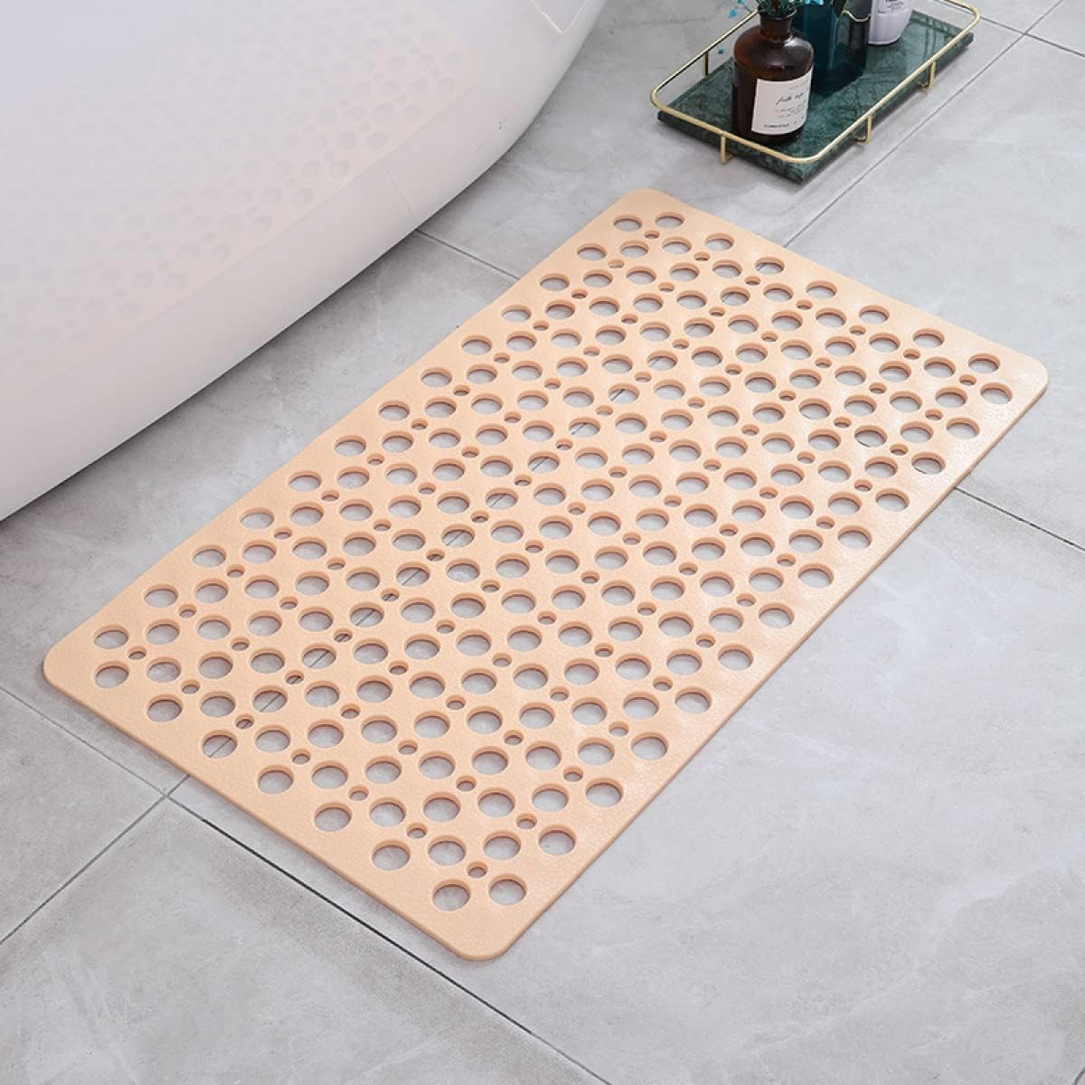 Beige perforated non-slip shower mat with antibacterial hole pattern