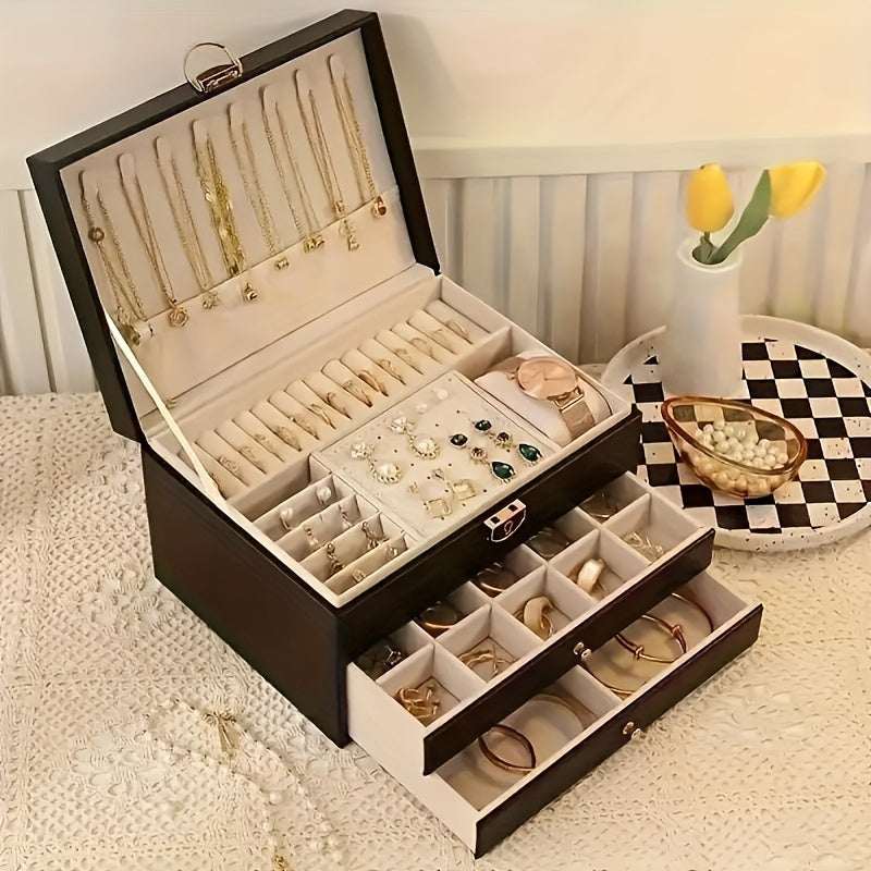 Black multi-layer jewelry storage box with open lid, ring tray, and necklace slots.