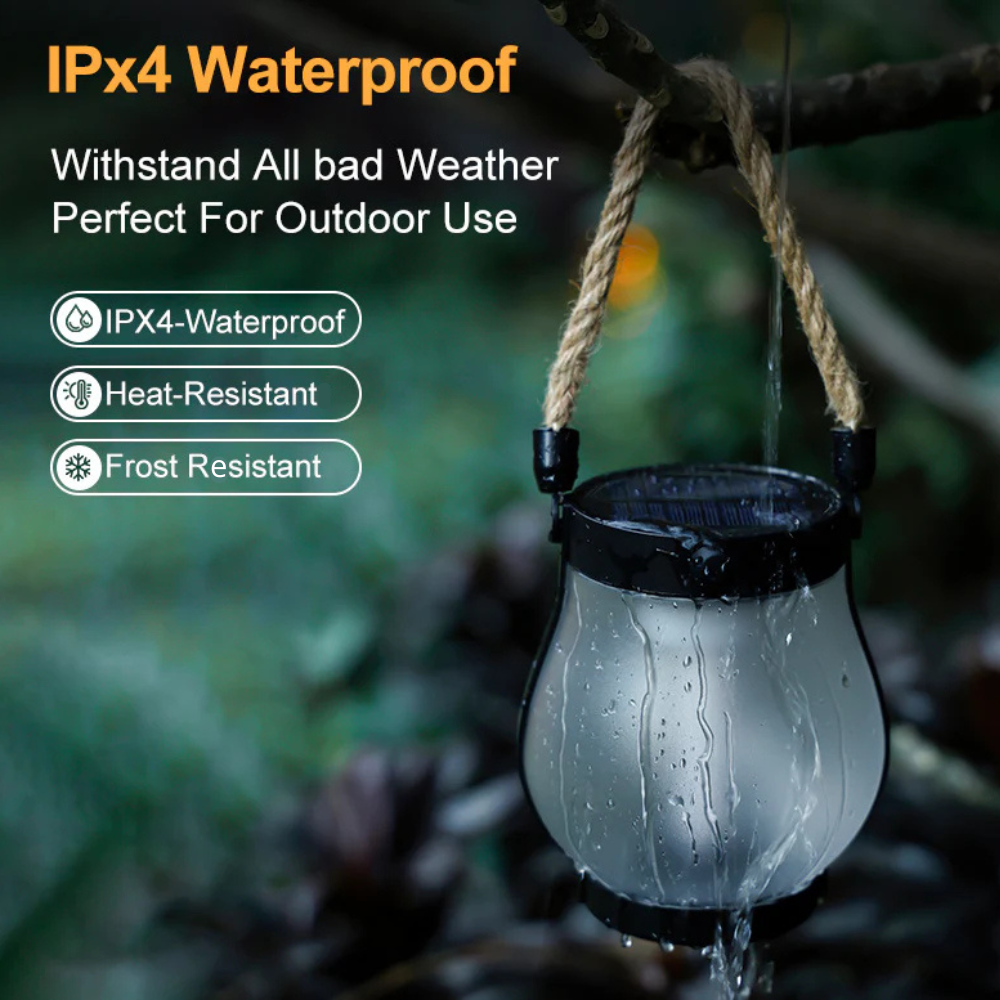 Waterproof solar flame lantern with black base, raindrops on clear glass bulb.