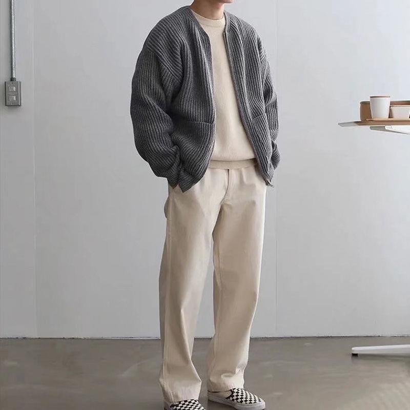 Men's zip knit cardigan in dark gray with ribbed knit texture, zip front, and pockets