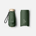 Dark green compact foldable mini umbrella with wrist strap and protective cover