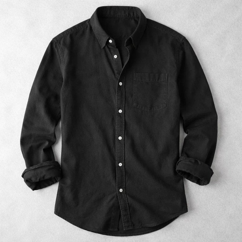 Black button-front relaxed shirt with chest pocket, long sleeves.