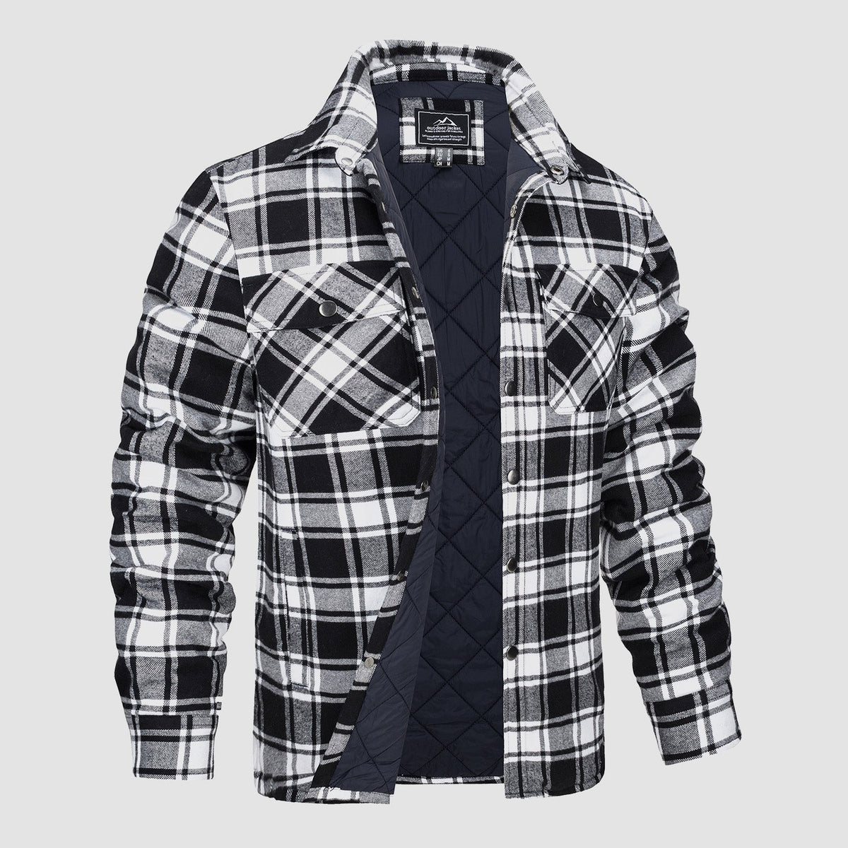 Men's plaid quilted shirt jacket in black and white with button front and chest pockets