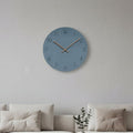 Blue round silent wall clock with black numerals and thin wood hands
