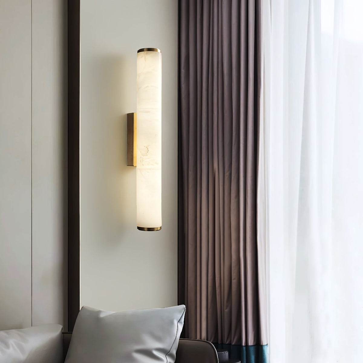 Wall-mounted lamp next to a curtain in a room setting