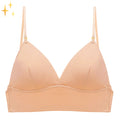 Beige seamless backless support bra with thin adjustable straps and low-cut front