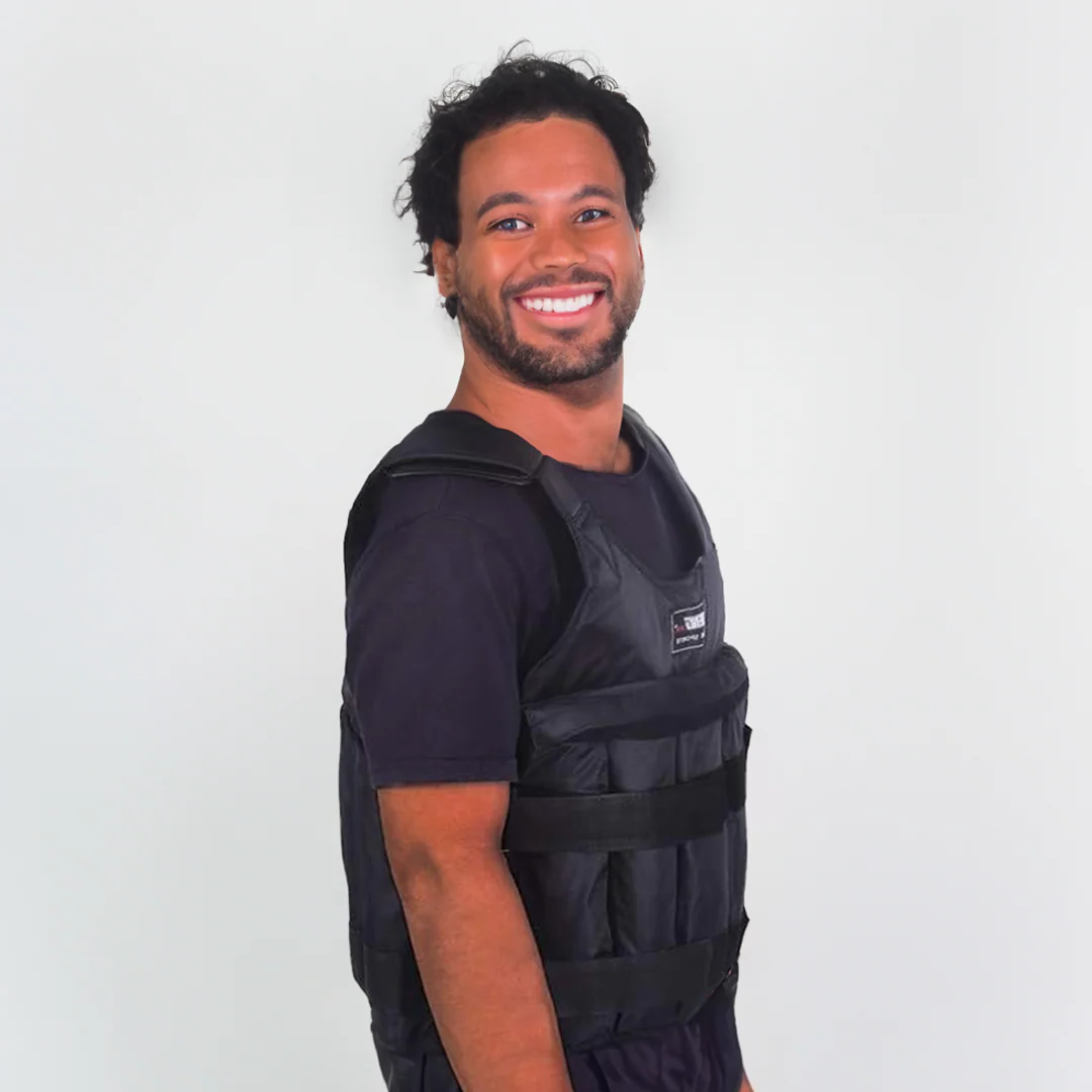 Black weighted exercise vest on a person, with front padded panels and adjustable band