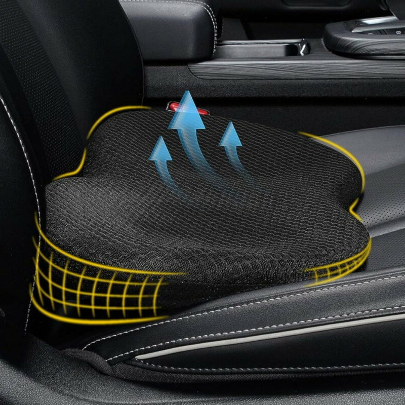 Black memory foam car seat cushion with yellow piping and contoured seat surface