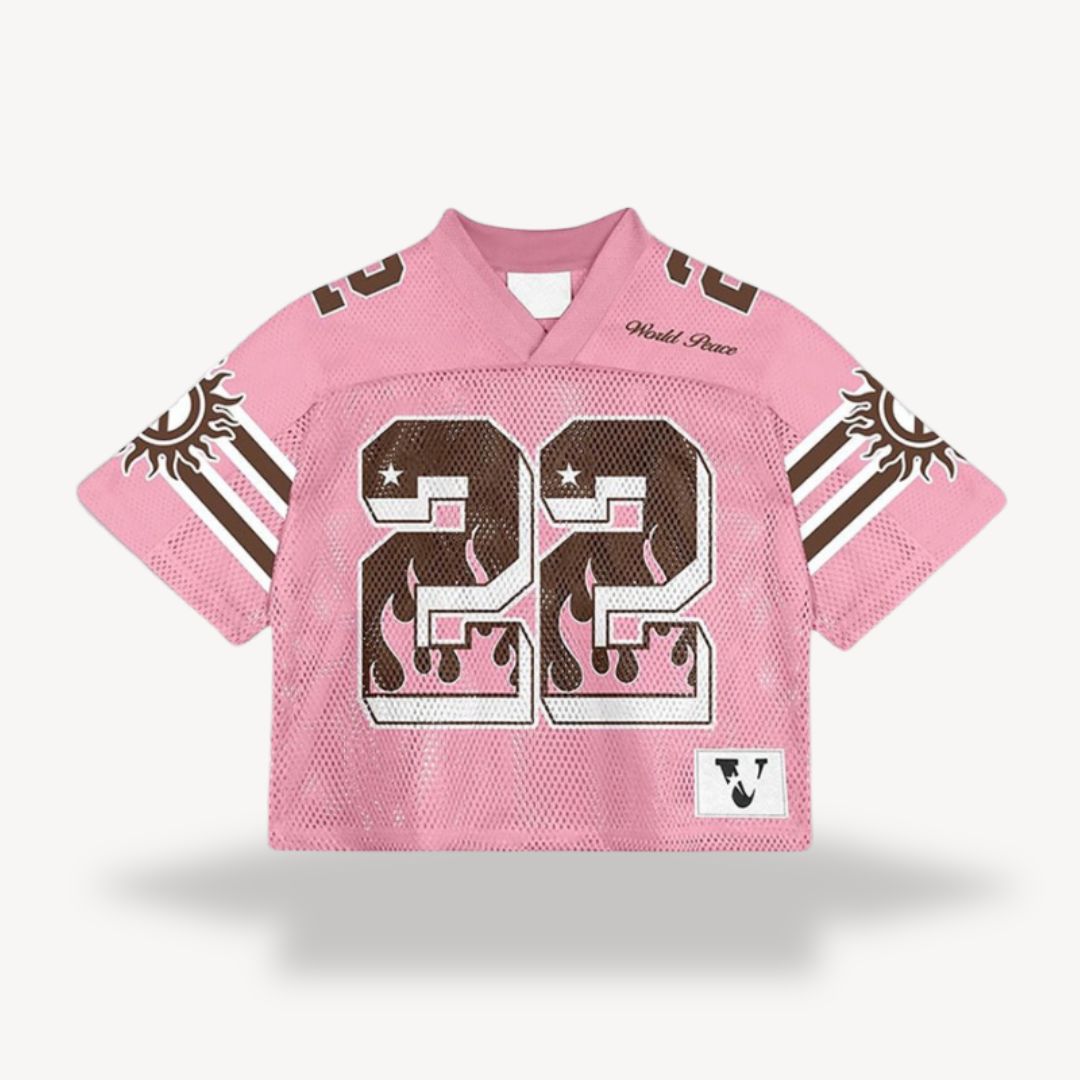 Pink V-neck short sleeve jersey shirt with white stripe sleeves and large number graphic