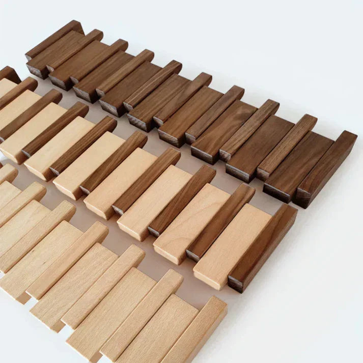 Assorted wooden slats and angled hooks for a piano-shaped coat rack