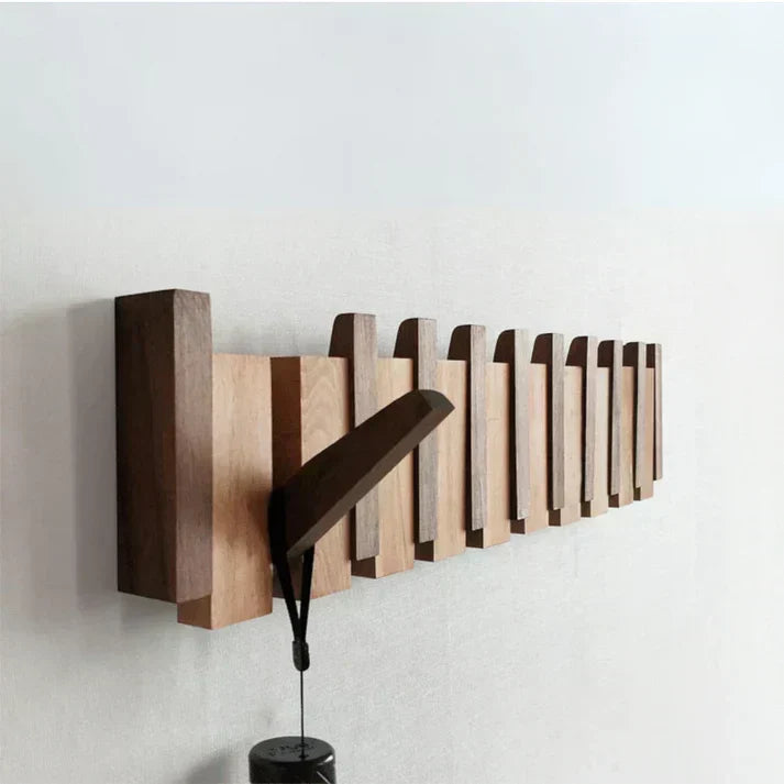 Fold-out wooden wall hook rack with a hanging umbrella-like stand