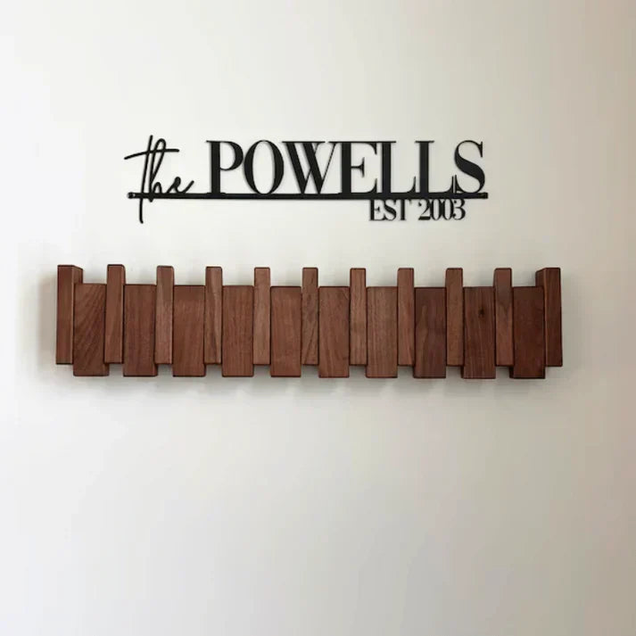 Wooden fold-out wall hook rail with multiple upright pegs