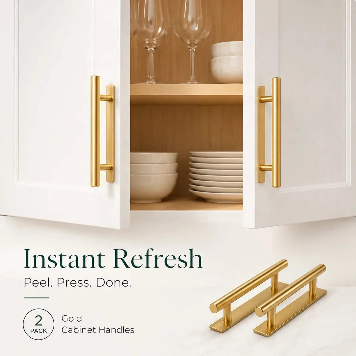 Gold cabinet handle set with two long bar pulls mounted on open cabinet