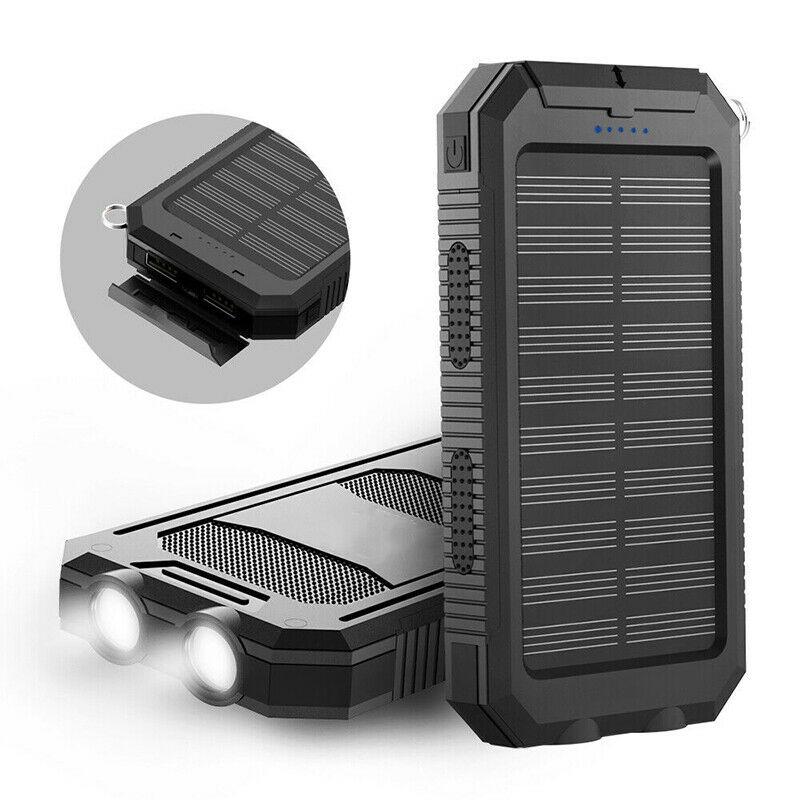 Black solar waterproof power bank with fold-out solar panel and charging ports detail