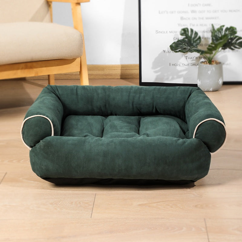 Green egg-crate memory foam dog bed with rounded bolsters and cushioned base