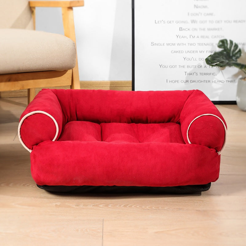 Red egg-crate memory foam dog bed with rounded side bolsters and quilted cushion look